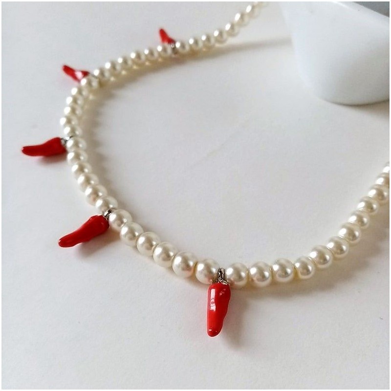 Detail of red chili pepper charms
