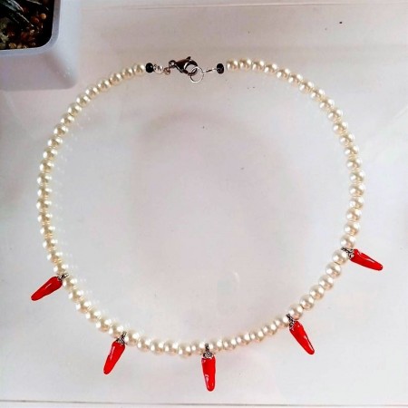 Pearl necklace with red chili peppers