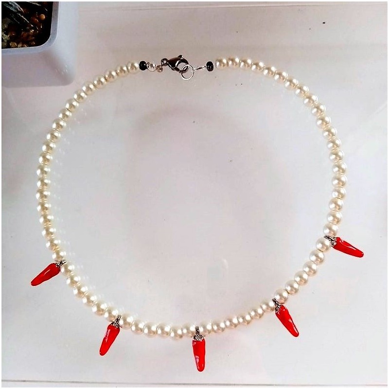 Pearl necklace with red chili peppers