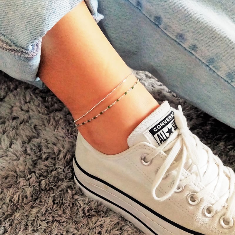 Sterling silver anklet with green beads showcased