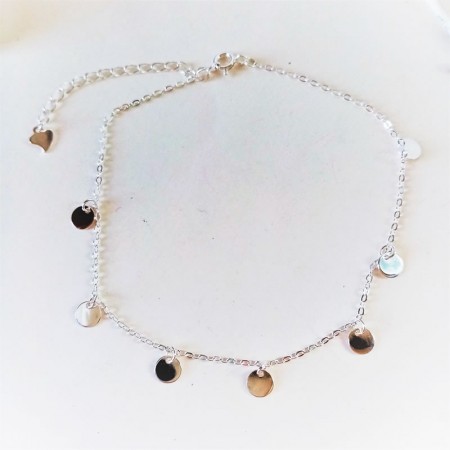 Youthful anklet in sterling silver with hanging charms.